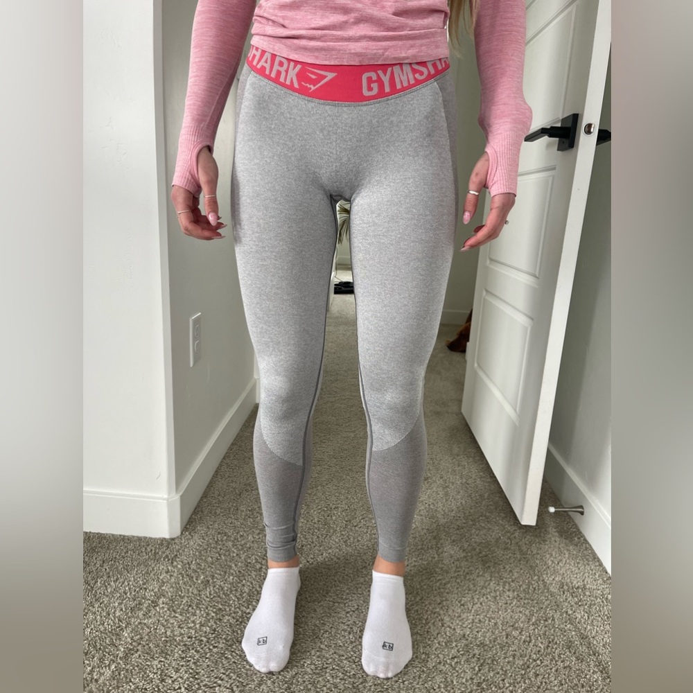 Gymshark light gray leggings with neon pink band. Size XS.